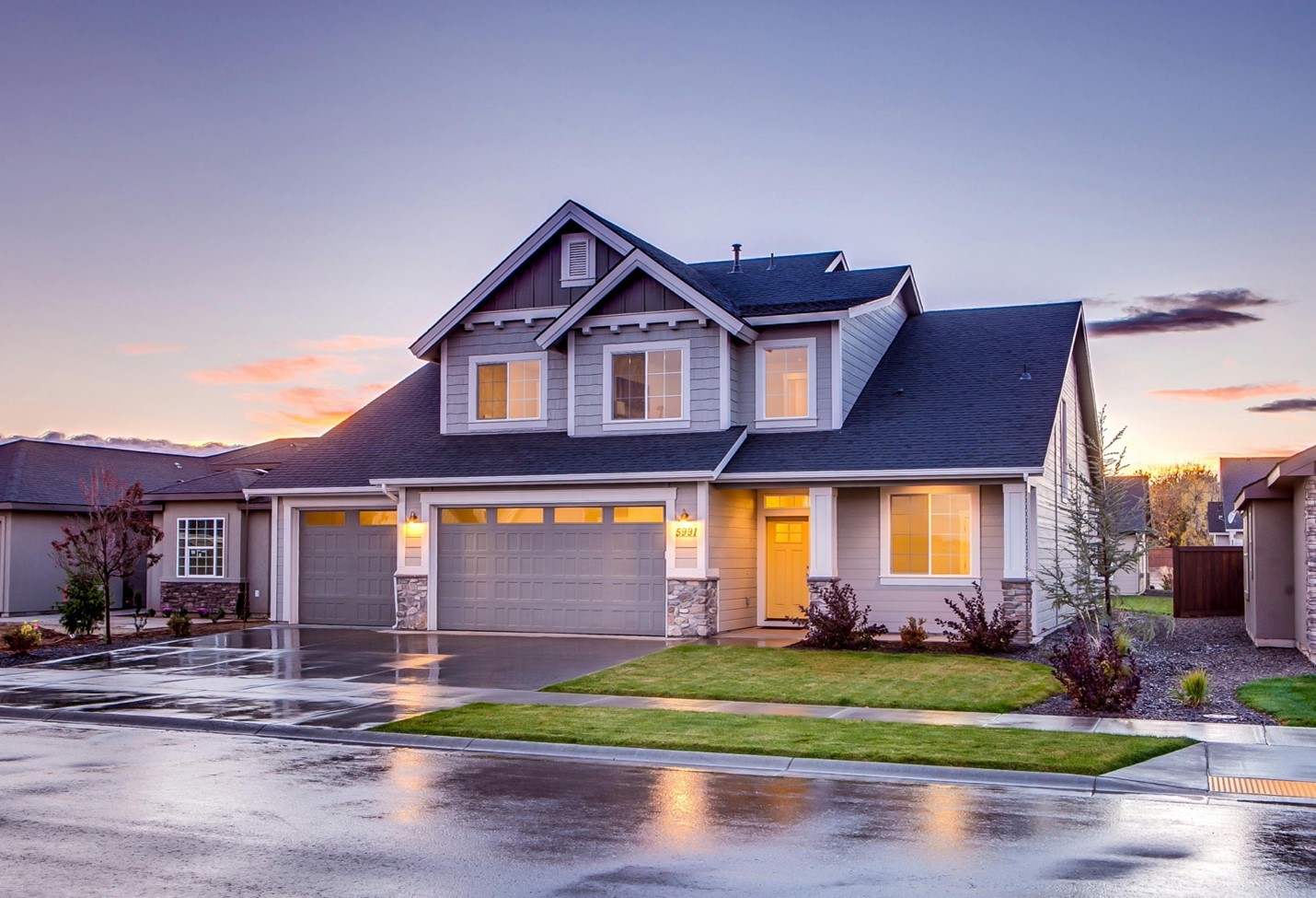 A two-story home in a residential neighborhood. Homes like this make up the “last mile” of fiber internet connectivity. So, with fiber to the home, this residence could get the fastest internet speeds available.